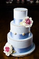Three tier cake vintage blue with buttons with gumpaste roses