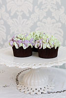 Green and pale purple buttercream hydrangea cupcakes.