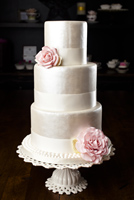 Three tier antique pearl finish cake with pink gumpaste roses