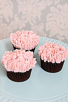 Pink buttercream carnation cupcakes.
